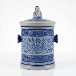 Antique Simon Peter Gerz 672 stoneware tobacco jar from the Westerwald, c.1880–1900, with cobalt-blue relief decoration and original Zwerg lid finial.