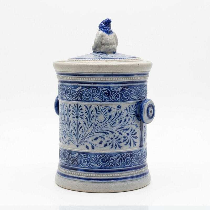 Antique Simon Peter Gerz 672 stoneware tobacco jar from the Westerwald, c.1880–1900, with cobalt-blue relief decoration and original Zwerg lid finial.