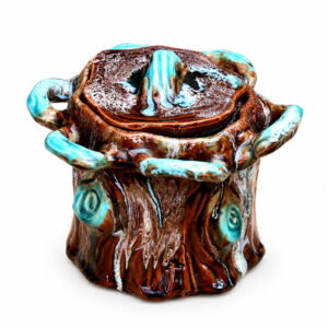 Vintage French ceramic tobacco jar featuring tree bark textures and turquoise blue glazed accents.